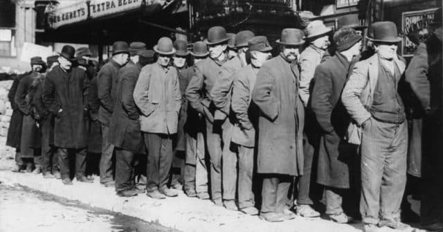 men standing in line black and white photo