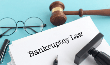 bankruptcy law with gavel and glasses